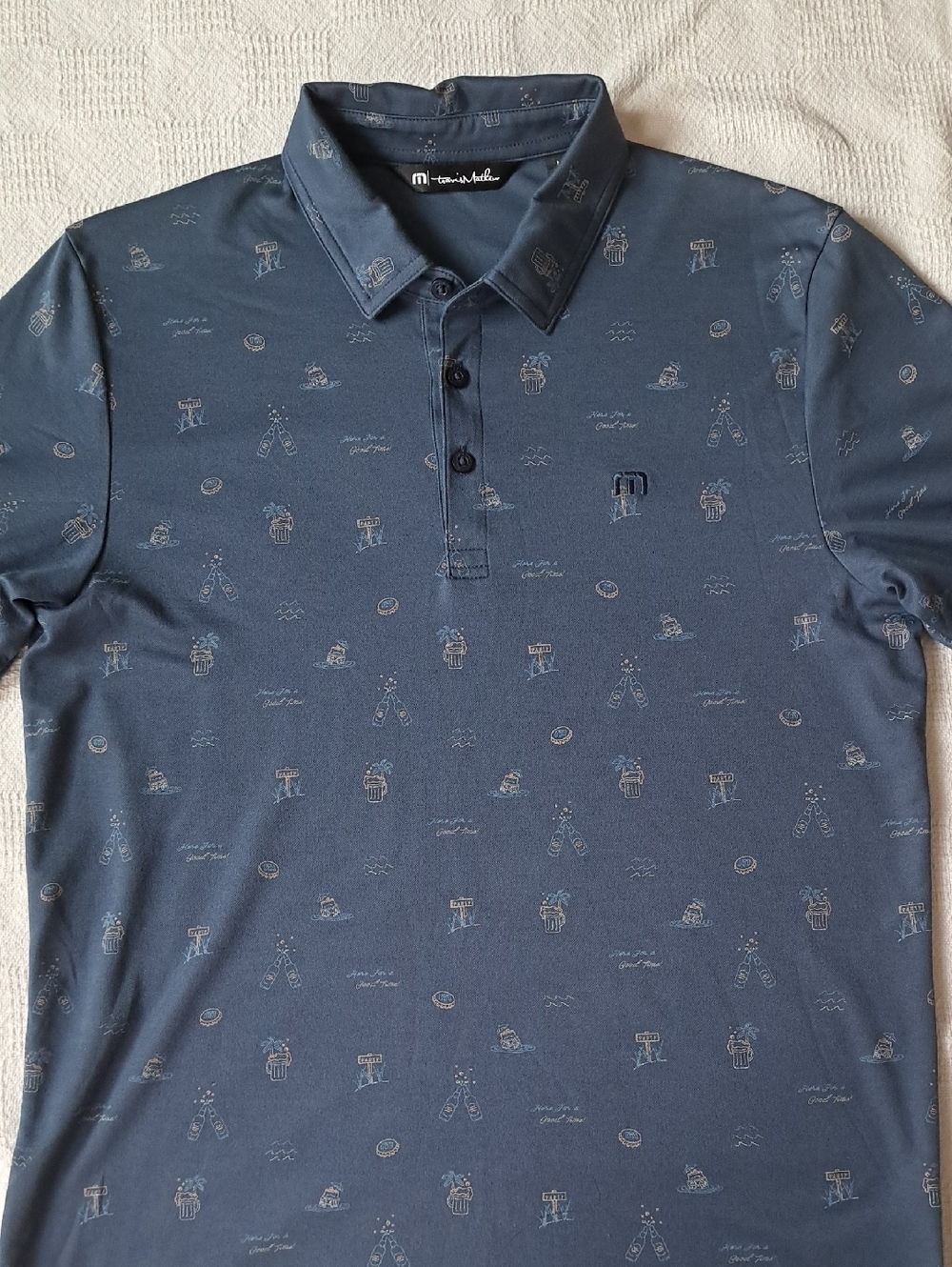 Travis Mathew Navy Polo with Subtle Resort Icons